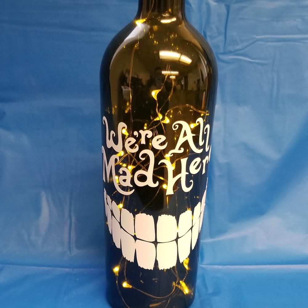 Lighted "We're all mad here" wine bottle